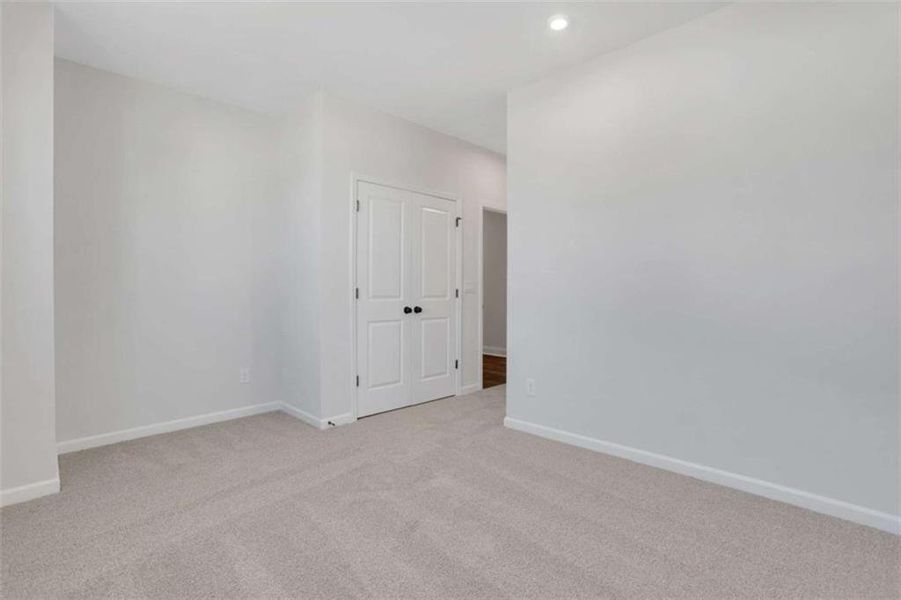 Spacious, unfurnished interior of a new home in The Paddocks at Doc Hughes, Buford (Image 32).