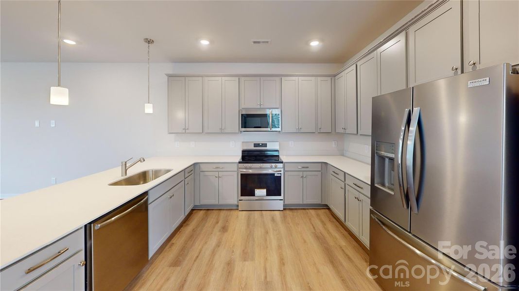 All photos representative of the Tinkham floorplan at Vanguard in Vermillion.