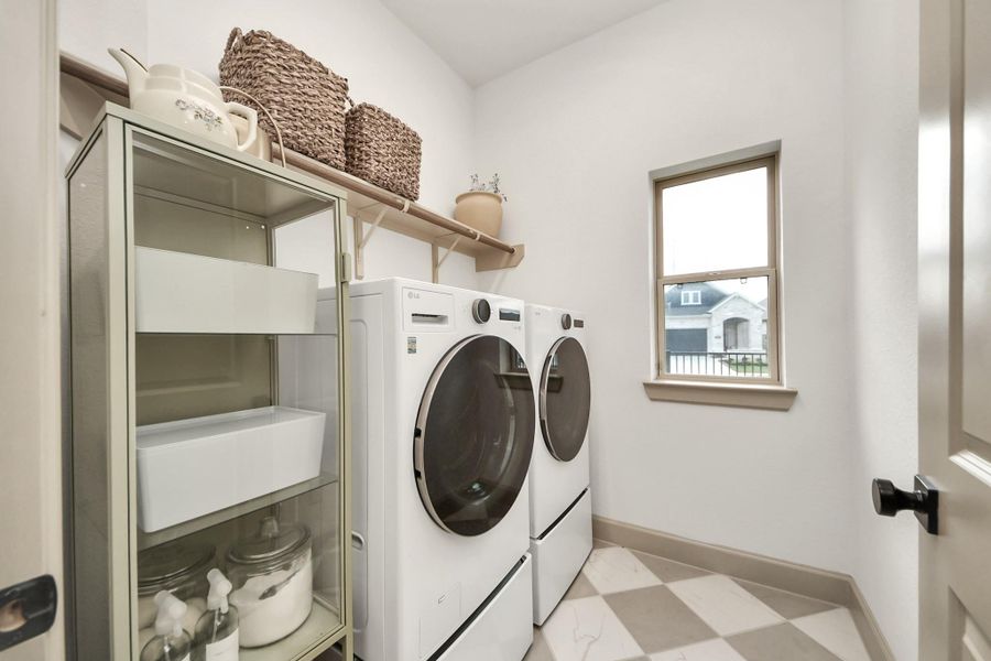 First floor laundry room with custom flooring.