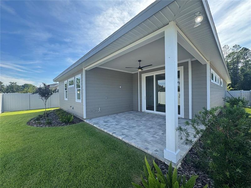 Front exterior of a new home in Laureate Village, Newberry, FL, highlighting curb appeal (Image 26). Front exterior of a new home in Laureate Village, Newberry, FL, highlighting curb appeal (Image 26).