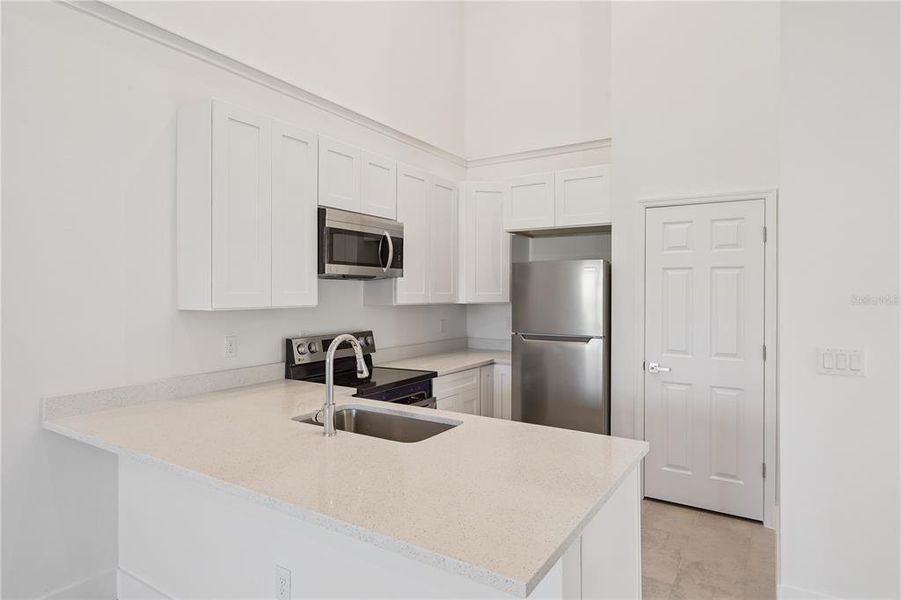 Furnished interior view inside a new home in , Kissimmee (Image 5).