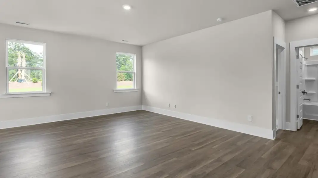 Representative unfurnished interior of a home built from the Forrester by D.R. Horton in The Highlands at Cedar Hill Landing, Navassa (Image 18).