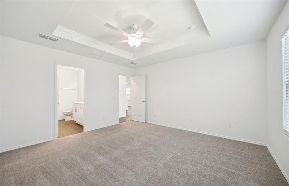 Spacious owner's suite highlighted by large windows and an exquisite tray ceiling Spacious owner's suite highlighted by large windows and an exquisite tray ceiling