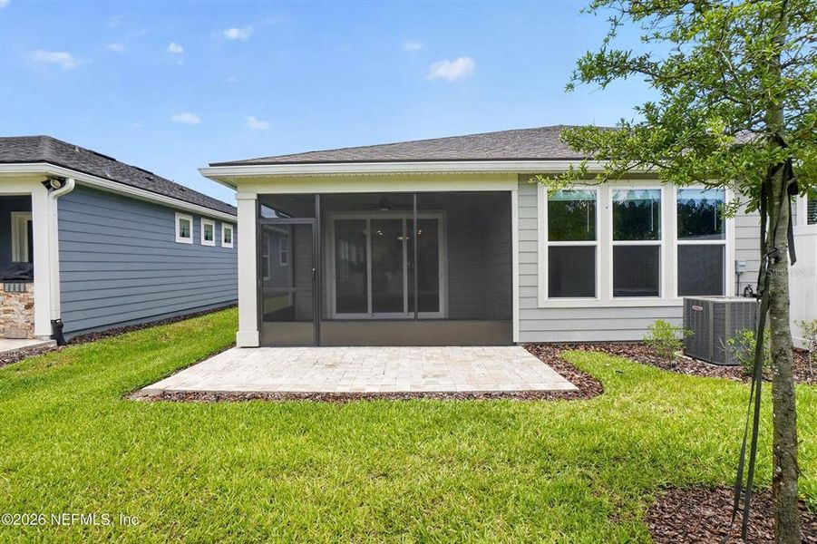 Exterior details and patio area of a home in Del Webb Wildlight, Wildlight (Image 28).