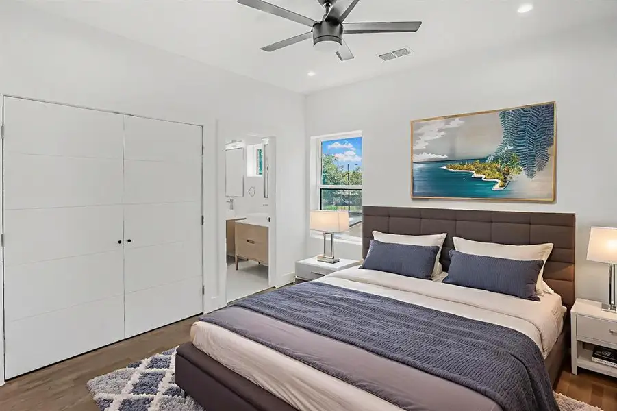 Bedroom featuring wood finished floors, recessed lighting, ensuite bathroom, and a ceiling fan