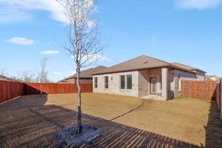 Exterior details and patio area of a home in , Anna (Image 3). Exterior details and patio area of a home in , Anna (Image 3).