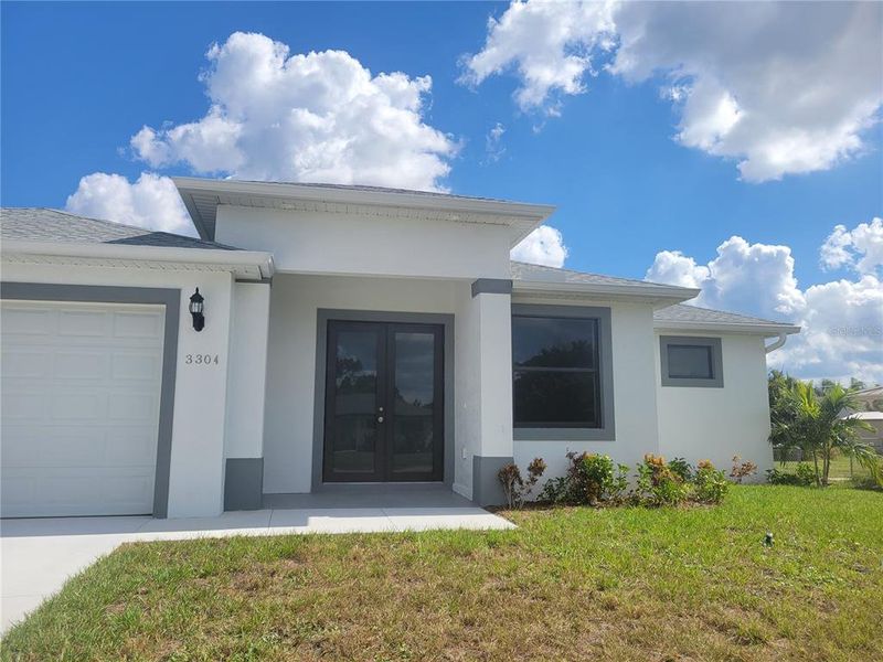 Front exterior of a new home in , Port Charlotte, FL, highlighting curb appeal (Image 1). Front exterior of a new home in , Port Charlotte, FL, highlighting curb appeal (Image 1).