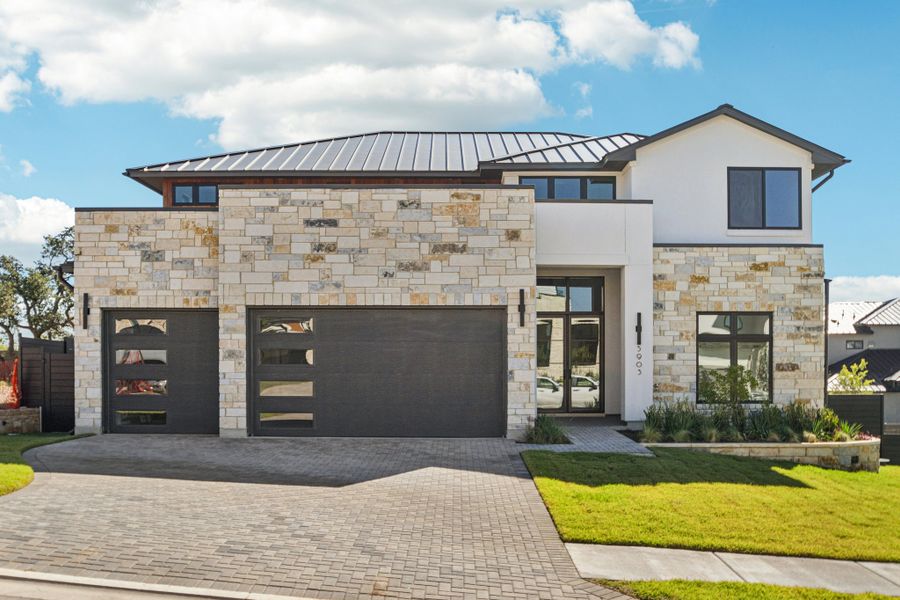 Front exterior of a new home in Milky Way at River Place, Austin, TX, highlighting curb appeal (Image 1).