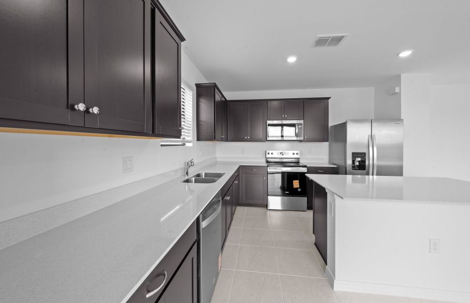 Furnished interior view inside a new home in Whispering Lakes, Lehigh Acres (Image 13).