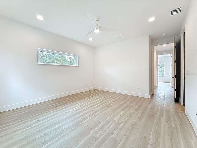 Elegant Primary Bedroom upstairs featuring a sleek en suite bath and abundant natural light. Elegant Primary Bedroom upstairs featuring a sleek en suite bath and abundant natural light.