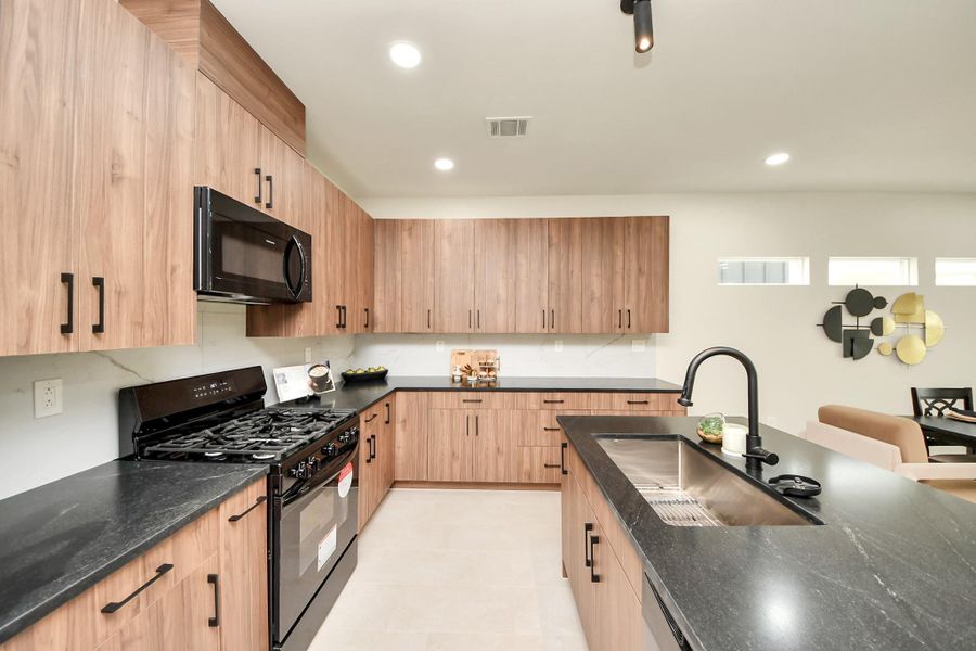 A bright, open-concept kitchen designed for both daily life and grand entertaining.