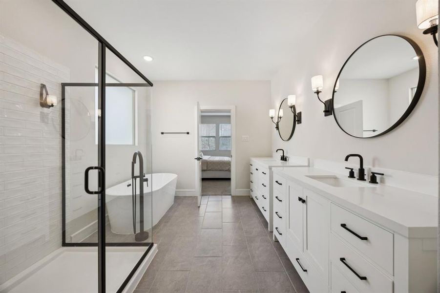 Relax and recharge in this elegant bath with dual vanities, deep soaking tub, and separate shower. Relax and recharge in this elegant bath with dual vanities, deep soaking tub, and separate shower.