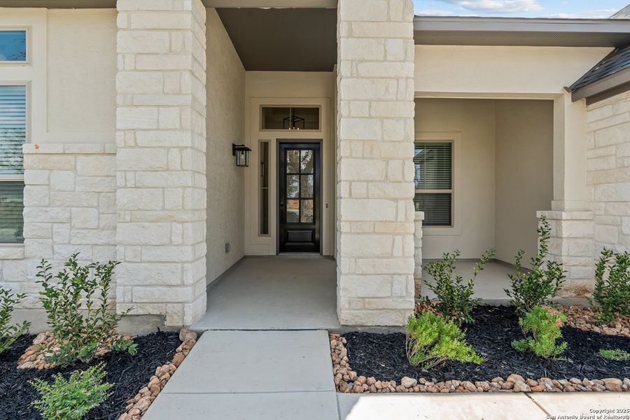 Front exterior of a new home in Mesa Western, Cibolo, TX, highlighting curb appeal (Image 22).