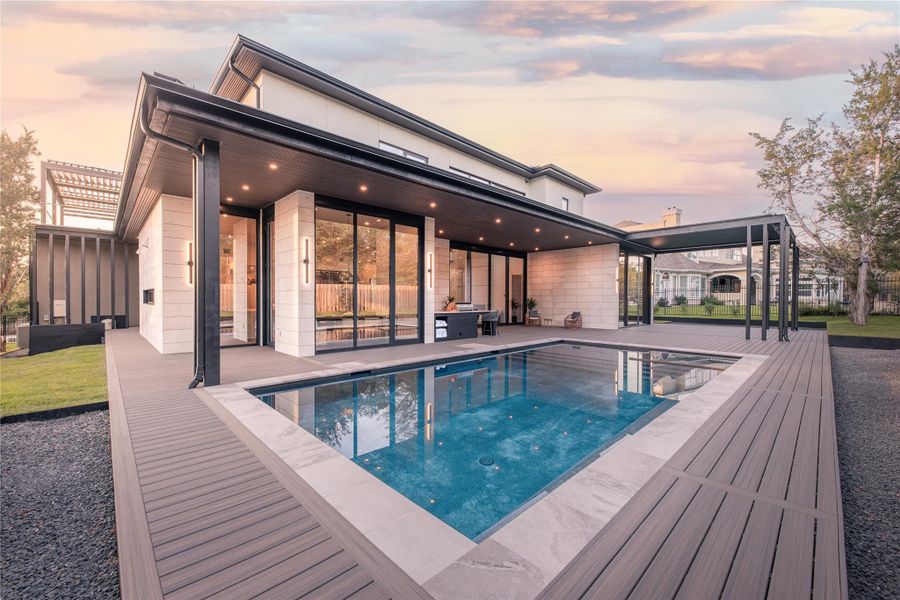 An inviting pool and spacious deck elevate outdoor living at this modern residence.