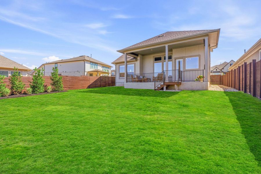 Back of property with a fenced backyard and a shingled roof Back of property with a fenced backyard and a shingled roof