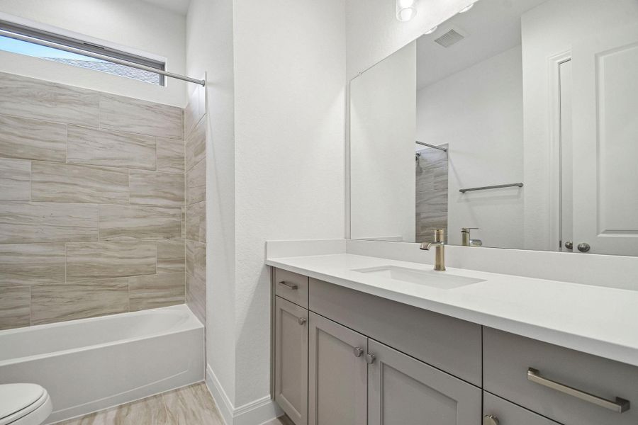 Furnished interior view inside a new home in 6 Creeks, Kyle (Image 8).