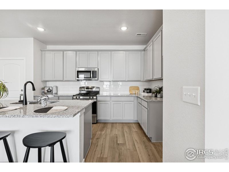 Furnished interior view inside a new home in Kinston Mainstreet Townhomes, Loveland (Image 31). Furnished interior view inside a new home in Kinston Mainstreet Townhomes, Loveland (Image 31).
