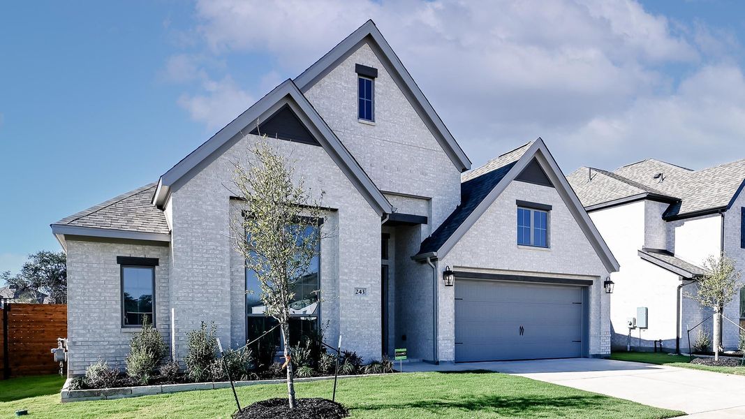 Front exterior of a new home in Juniper Springs, Lockhart, TX, highlighting curb appeal (Image 2).