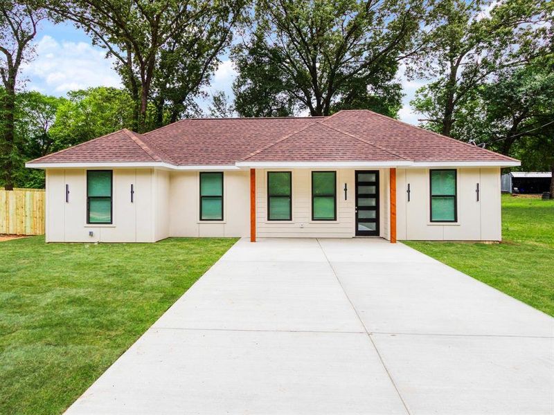 Ranch-style exterior with a brown shingle roof and light-colored siding Ranch-style exterior with a brown shingle roof and light-colored siding