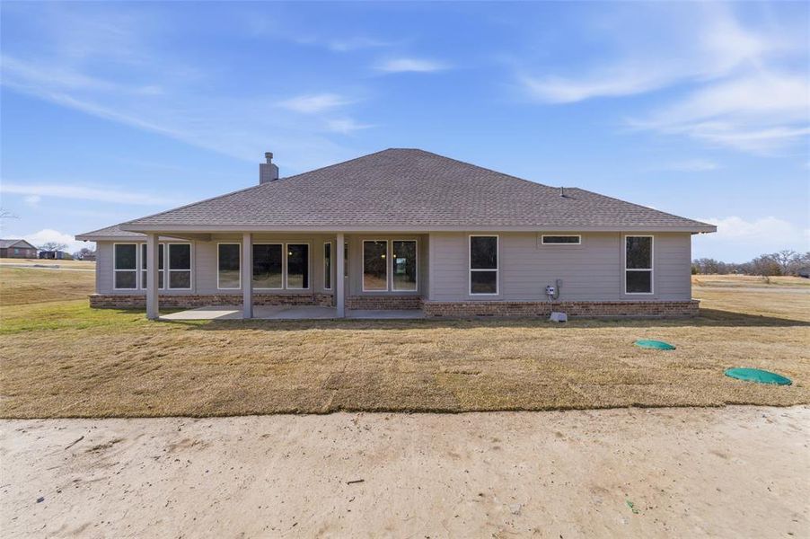 Exterior details and patio area of a home in Oak Grove Addition, Springtown (Image 17).