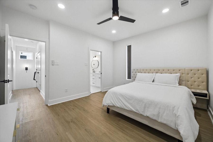 Primary suite takes the top floor, with space for a king and an upholstered headboard wall. Ensuite opens right off the bedroom. Primary suite takes the top floor, with space for a king and an upholstered headboard wall. Ensuite opens right off the bedroom.