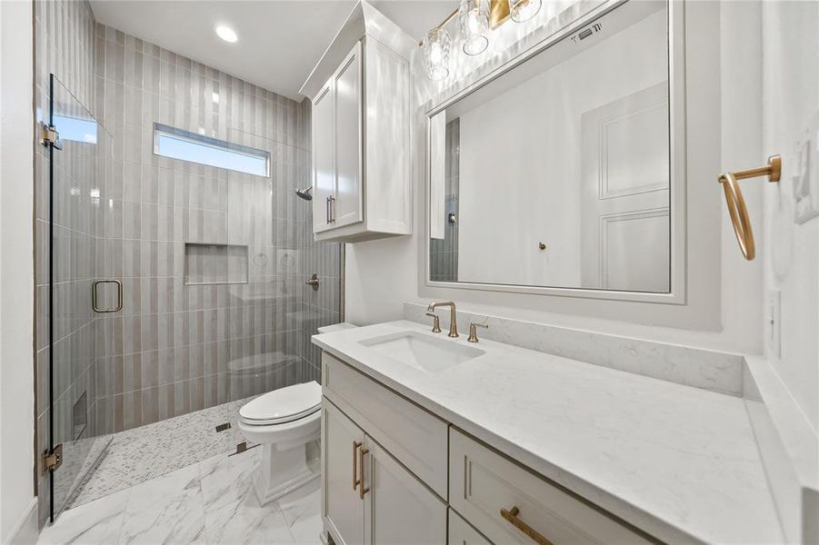 Bathroom with vanity, a shower stall, and recessed lighting Bathroom with vanity, a shower stall, and recessed lighting