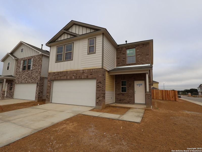 Front exterior of a new home in Winding Brook, San Antonio, TX, highlighting curb appeal (Image 23). Front exterior of a new home in Winding Brook, San Antonio, TX, highlighting curb appeal (Image 23).