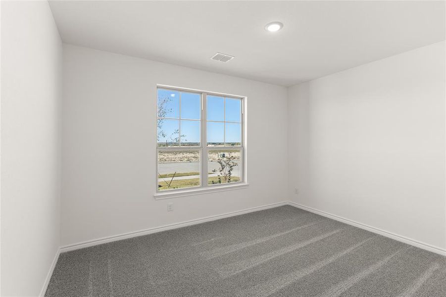 Empty room featuring carpet flooring