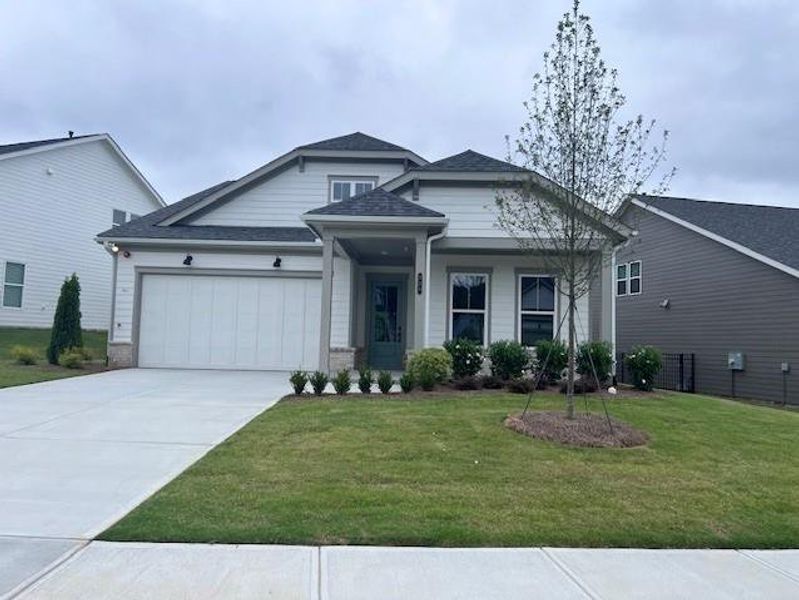 Front exterior of a new home in The Reserve at Bells Ferry, Kennesaw, GA, highlighting curb appeal (Image 1).