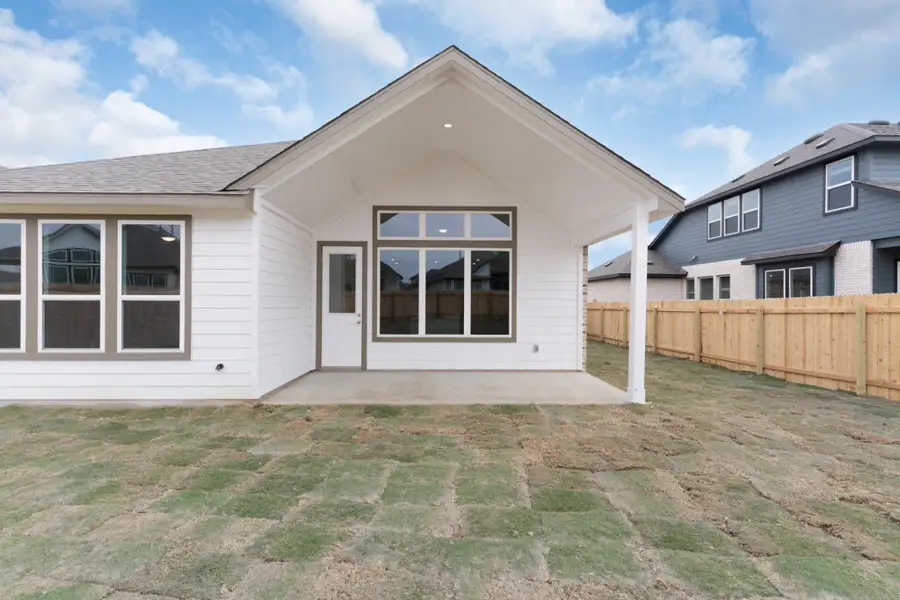 Exterior details and patio area of a home in Carillon, Manor (Image 4).