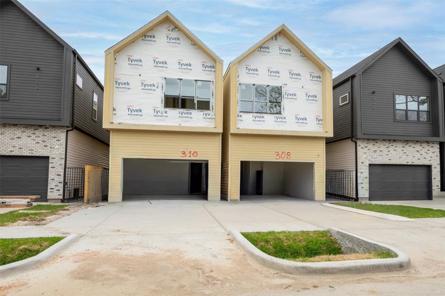 Front exterior of a new home in , Houston, TX, highlighting curb appeal (Image 27).
