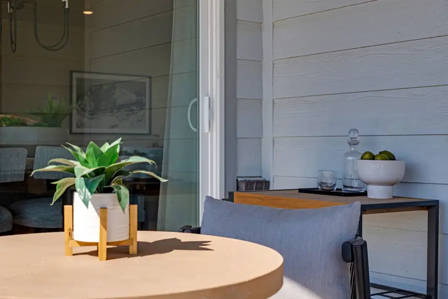 Exterior details and patio area of a home in Painted Prairie, Aurora (Image 3).
