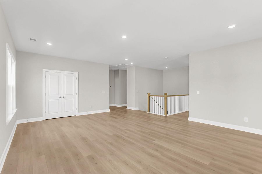 Spacious, unfurnished interior of a new home in Tidewater at Lakes of Cane Bay, Summerville (Image 41).