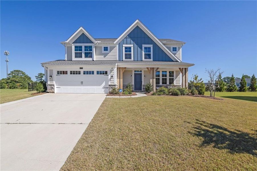 Front exterior of a new home in Sweetbay Farm, Lawrenceville, GA, highlighting curb appeal (Image 22).