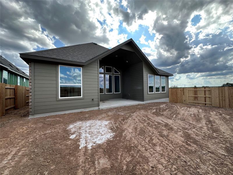 A newly constructed residence awaits, offering a blank canvas for personalized landscaping and outdoor living.