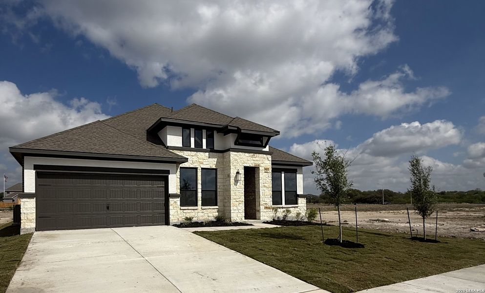 Front exterior of a new home in Buffalo Crossing, Cibolo, TX, highlighting curb appeal (Image 4).