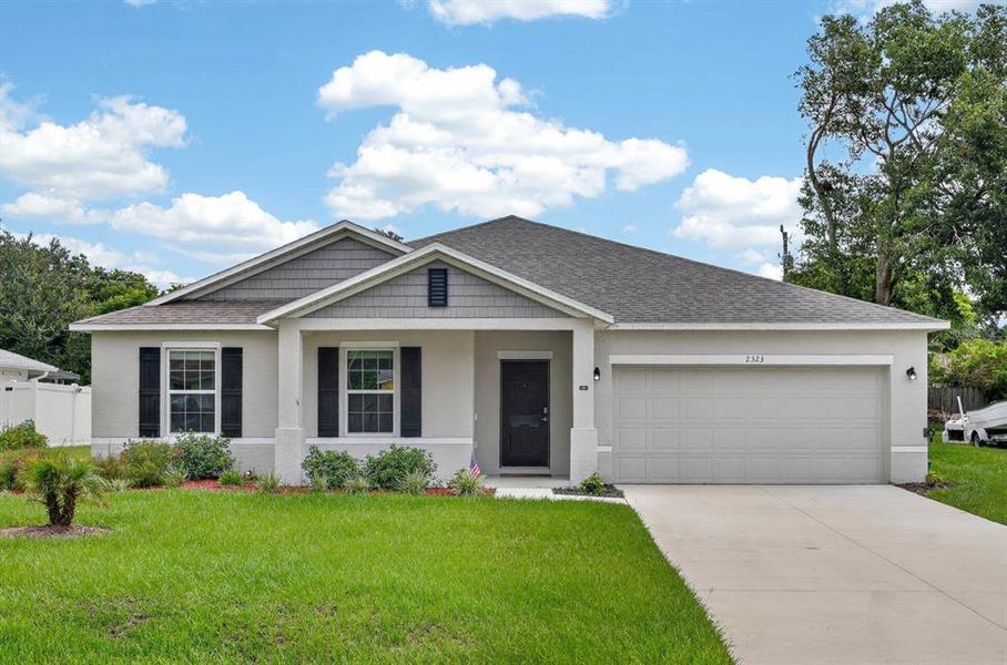 Front exterior of a new home in , Edgewater, FL, highlighting curb appeal (Image 23). Front exterior of a new home in , Edgewater, FL, highlighting curb appeal (Image 23).