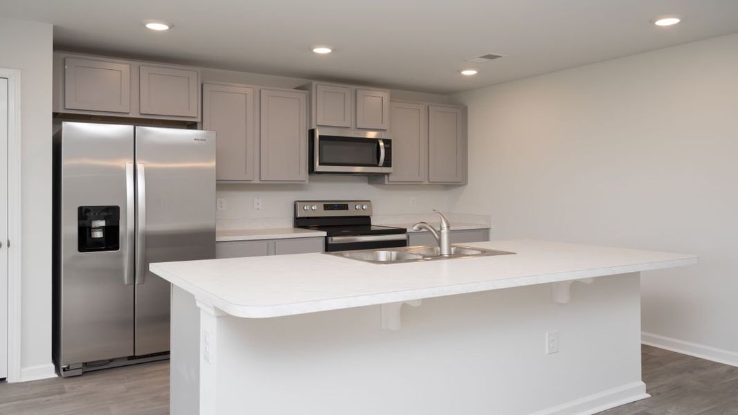Representative furnished interior of a home built from the KERRY by D.R. Horton in Stanbury Creek, Supply (Image 7).