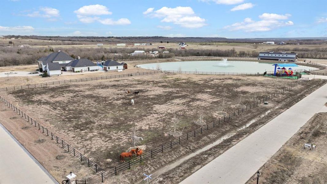 Birds eye view of property with a rural view