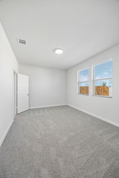 Primary Bedroom in the Birch home plan by Trophy Signature Homes – REPRESENTATIVE PHOTO
