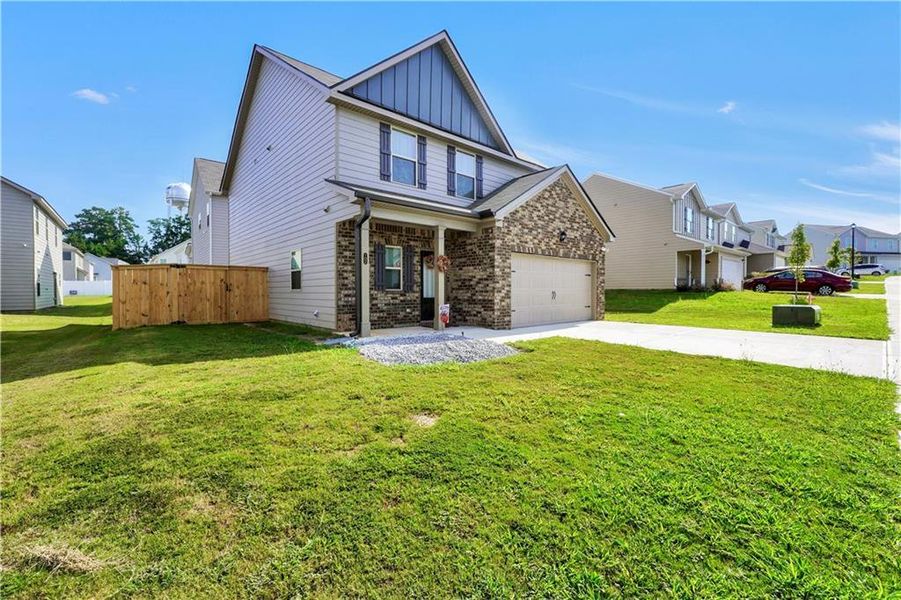 Exterior details and patio area of a home in Garden Walk, Jackson (Image 3).