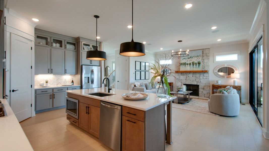 Kitchen area opening up to gathering area Kitchen area opening up to gathering area