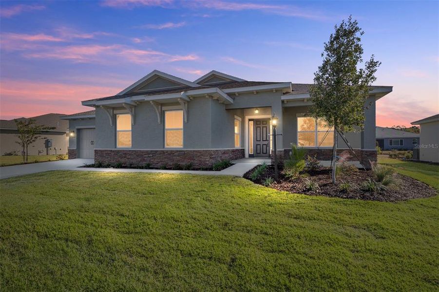 Front exterior of a new home in On Top of the World Communities, Ocala, FL, highlighting curb appeal (Image 2).