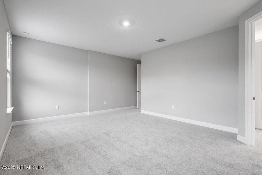 Spacious, unfurnished interior of a new home in Colbert Landings, Palm Coast (Image 30).