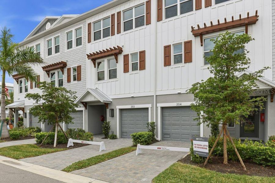 Front exterior of a new home in Seahaven, Punta Gorda, FL, highlighting curb appeal (Image 1). Front exterior of a new home in Seahaven, Punta Gorda, FL, highlighting curb appeal (Image 1).