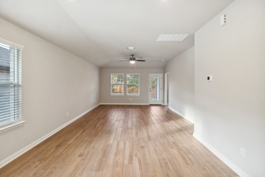 Living and dining room in the Cascade floorplan at a Meritage Homes community.