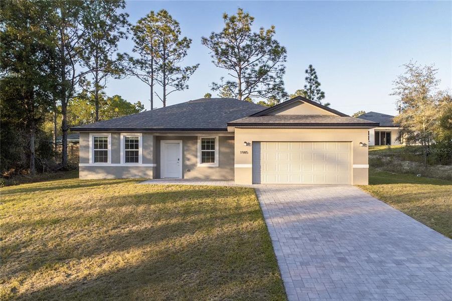Front exterior of a new home in , Citrus Springs, FL, highlighting curb appeal (Image 21).