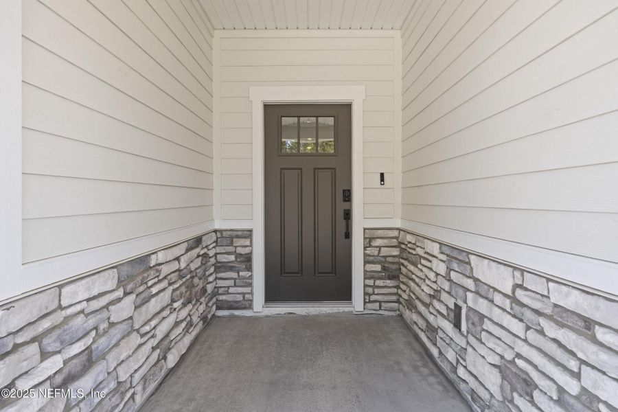 Exterior details and patio area of a home in The Cypress Series at Reserve East, Flagler Beach (Image 24).