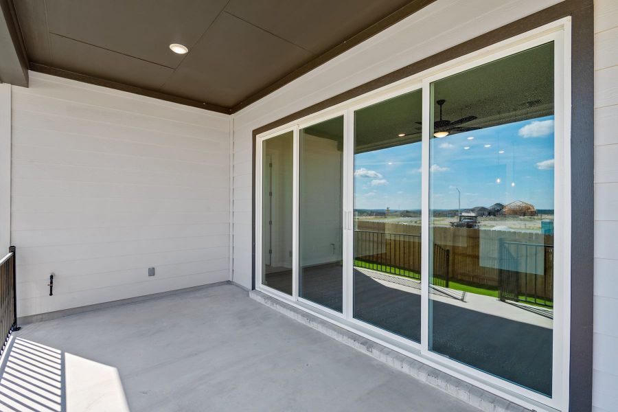 Exterior details and patio area of a home in Lariat, Liberty Hill (Image 23).