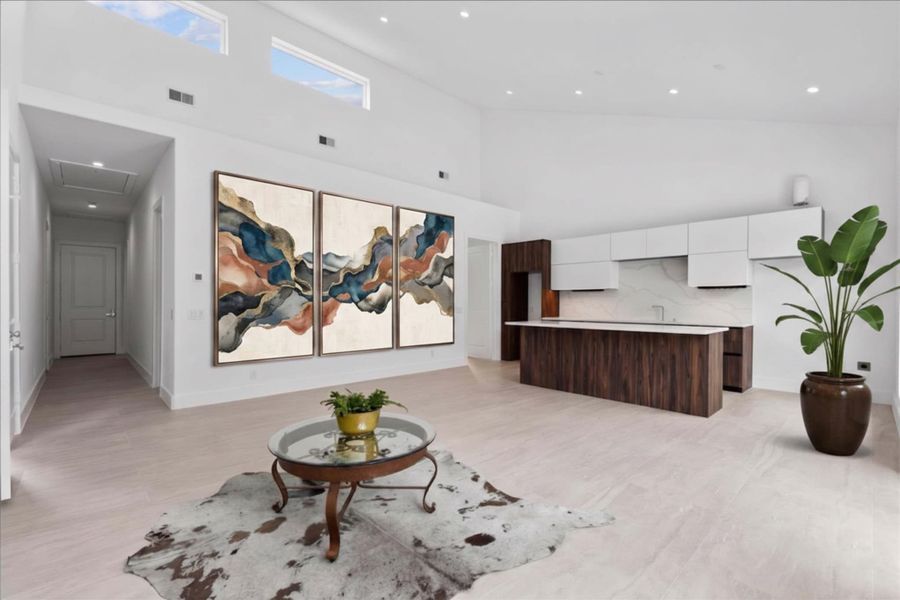 Just across the foyer is the ultimate guest experience. This separate living suite features its own fully equipped kitchen offering total independence for guests or multi-generational living. Plus, private access to 1 of the 2 car garages.